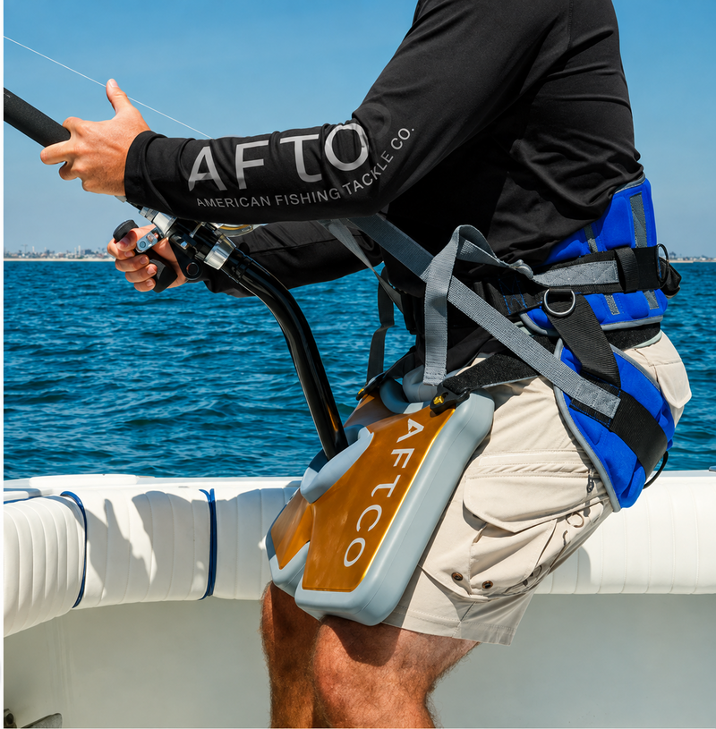 Load image into Gallery viewer, Angler wearing AFTCO MaxForce Stand-Up Harness while offshore fishing
