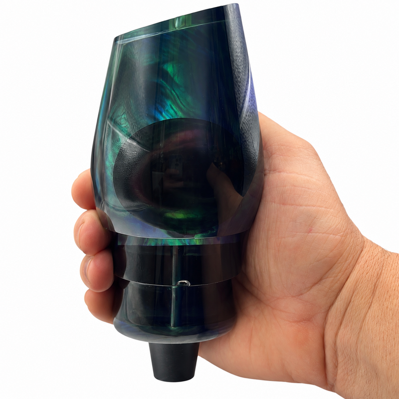 Load image into Gallery viewer, Bottom angled view of Andy’s Not a Sumo Black Back Smoke Bottom offshore trolling lure head with White MOP shown in hand

