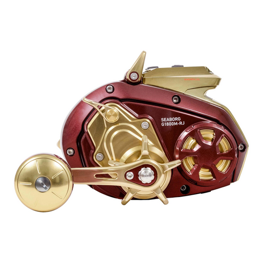 Daiwa Seaborg G1800M-RJ electric fishing reel side profile showing gold power handle, Magsealed housing and model marking.