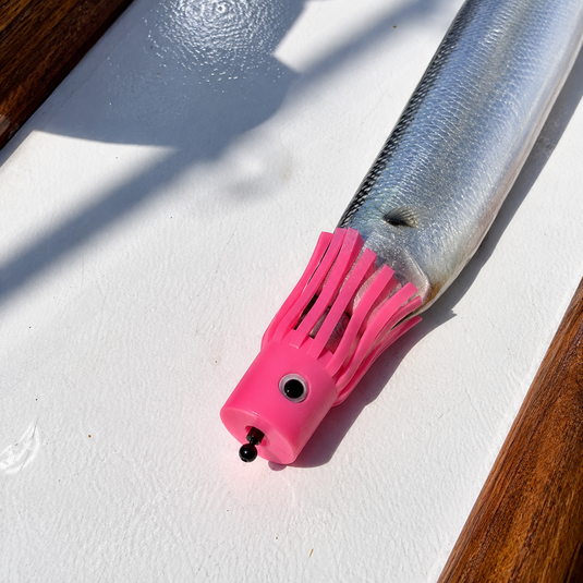 EZ-Bait Rigging Swivel with pink skirt rigged on baitfish for offshore fishing