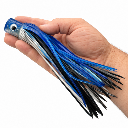 Mold Craft Blue White Standard Hooker 8-inch trolling lure held in hand for size reference, featuring a glitter blue head and blue, black and silver skirt.