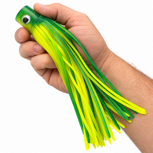 Mold Craft Green Yellow Standard Hooker 8-inch trolling lure held in hand to show size, featuring a glitter green head and bright yellow and green skirt.