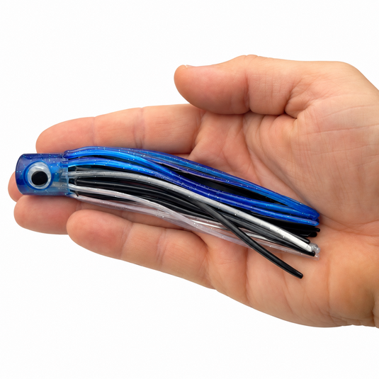 Mold Craft Little Hook 5.5-inch Blue/Black/Silver trolling lure displayed in hand for size reference, featuring a blue glitter head and blue, black, and silver skirt.