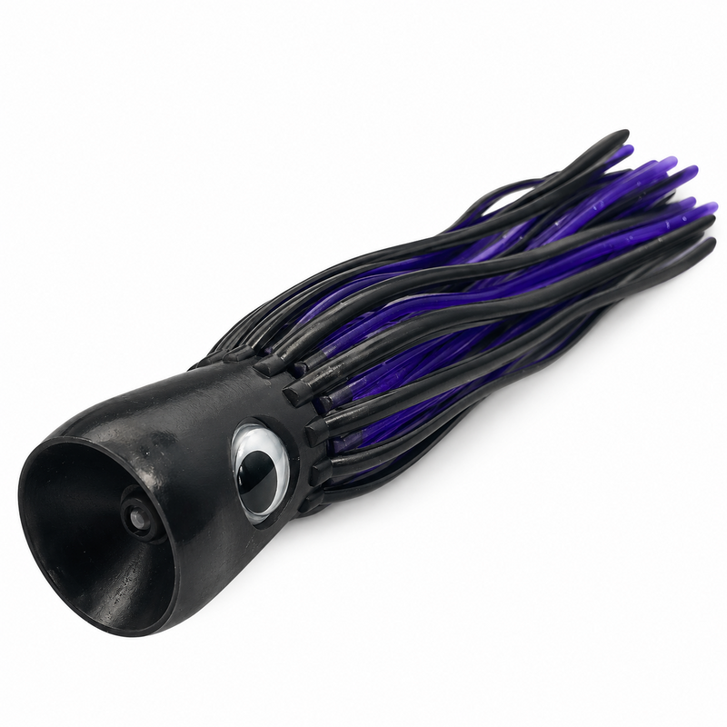 Load image into Gallery viewer, Mold Craft Little Super Chugger 5.5 inch Black/Purple lure showing its concave scoop face, black head, large eye and black-and-purple skirt.
