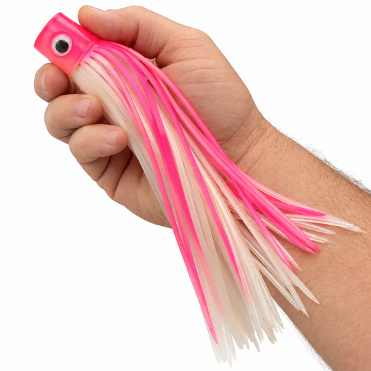 Mold Craft Pink White Standard Hooker 8-inch trolling lure held in hand for size reference, featuring a glitter pink head and pink and white skirt.