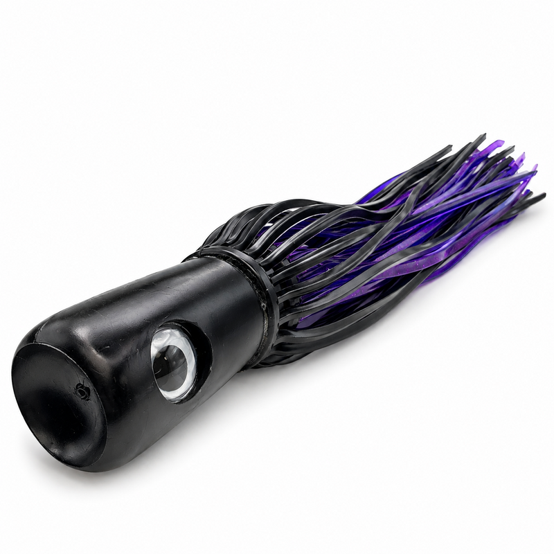 Load image into Gallery viewer, Mold Craft Senior Super Chugger Black/Purple offshore trolling lure showing its concave black head, large eye, and black-and-purple skirt on a white background.
