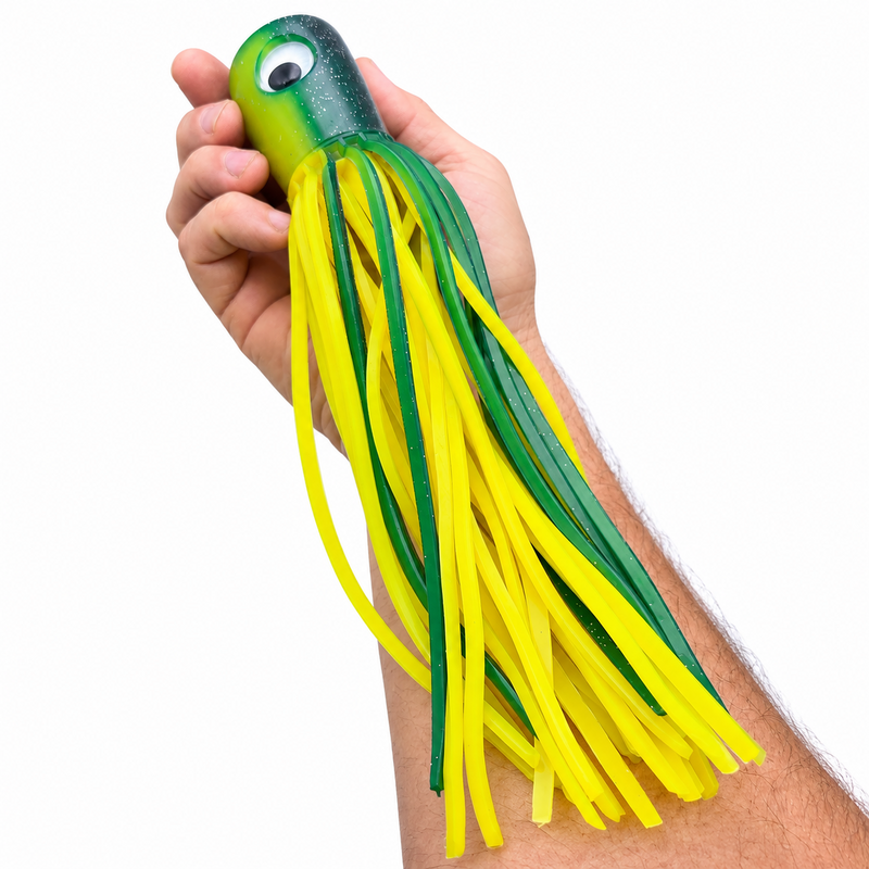 Load image into Gallery viewer, Mold Craft Senior Super Chugger Green/Yellow trolling lure held in hand for size reference, featuring a green glitter head and bright green-and-yellow skirt.
