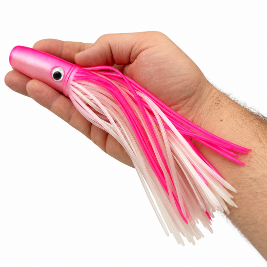 Mold Craft Standard Wide Range 9½-inch Pink White trolling lure held in hand for size reference, featuring a pink head and pink and pearl white skirt on white background.